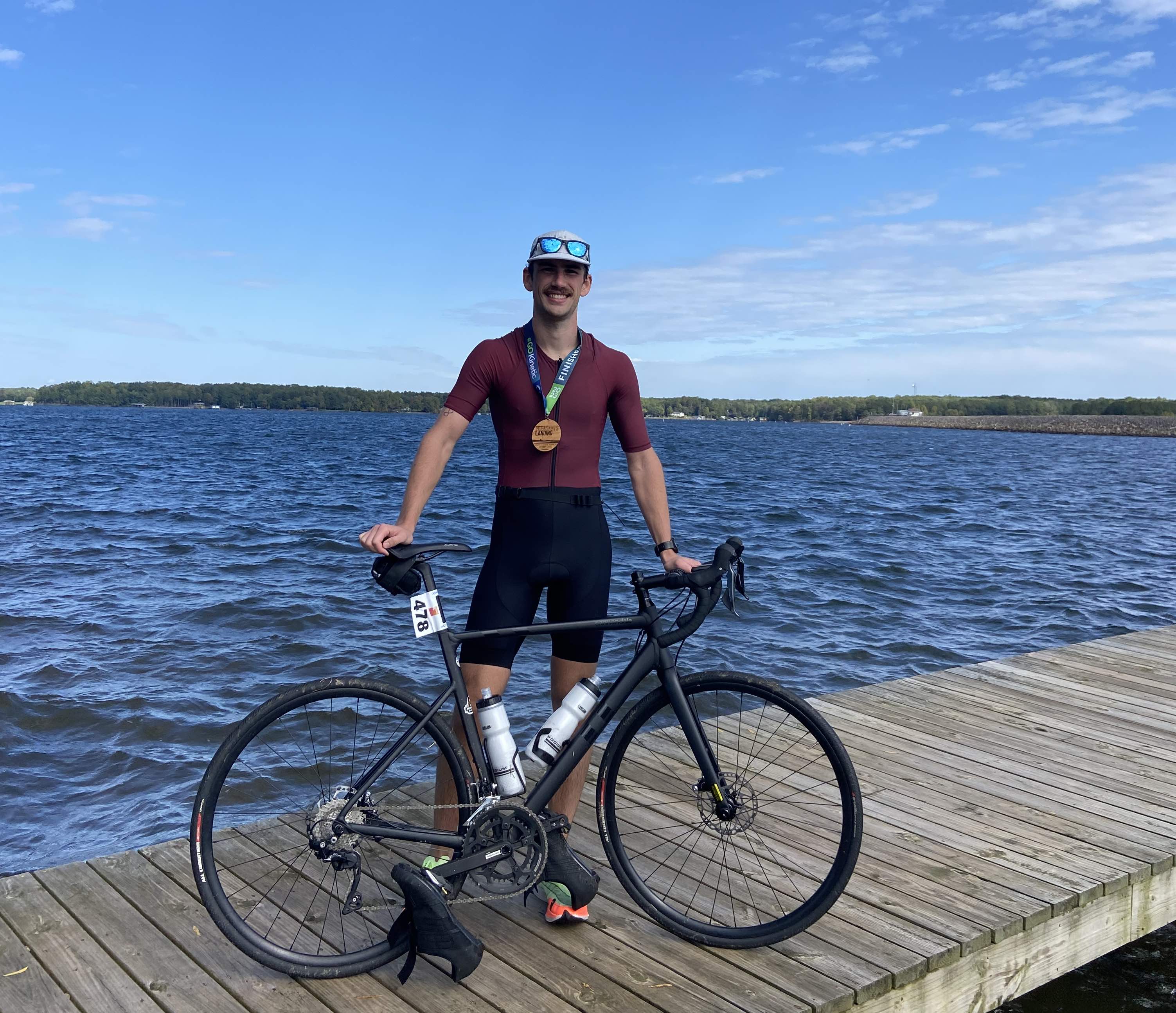 Posing with bike after first triathlon